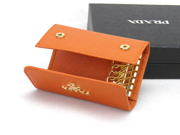 Sold at Auction: Prada - Key Holder Wallet - Tan - Saffiano Leather - Gold  hardware